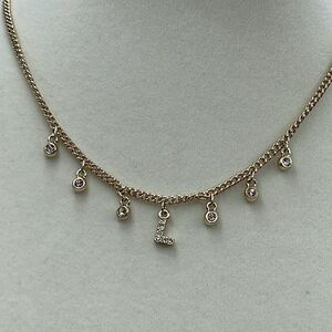 WHBM “L” dangle rhinestone gold colored choker .